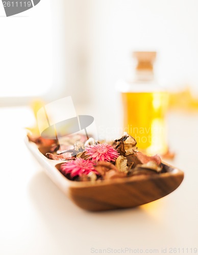 Image of closeup of essential oil, flowers and pot-pourri