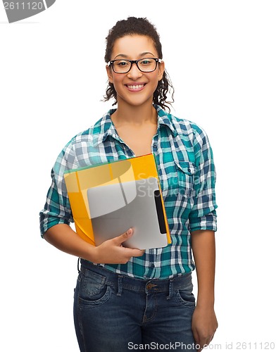 Image of student in eyeglasses with folders and tablet pc