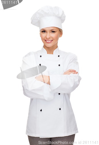 Image of smiling female chef with crossed arms