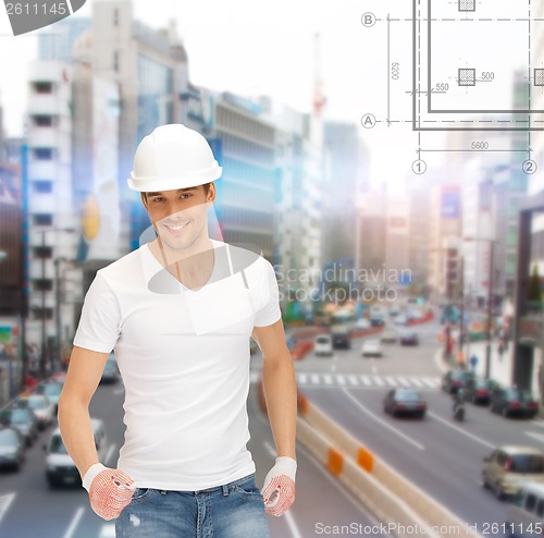 Image of handsome builder in helmet