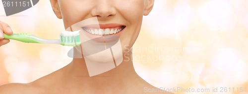 Image of beautiful woman with toothbrush