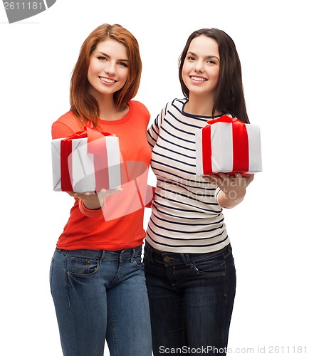 Image of two smiling teenage girls with presents