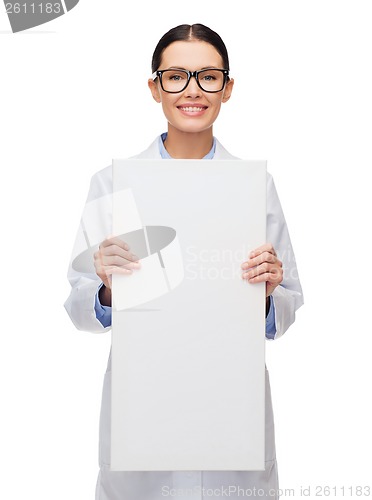 Image of female doctor in eyeglasses with white blank board