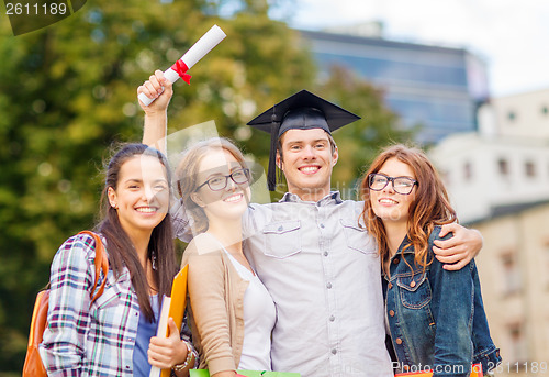 Image of students or teenagers with files and diploma