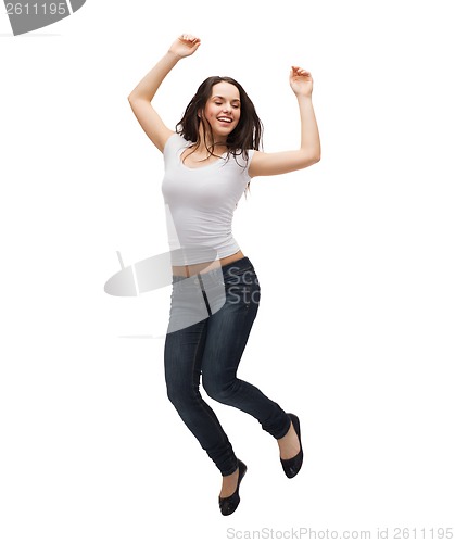 Image of teenage girl in white blank t-shirt jumping