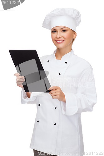 Image of smiling female chef with black blank paper