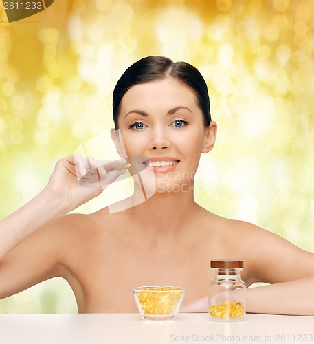 Image of beautiful woman with omega 3 vitamins