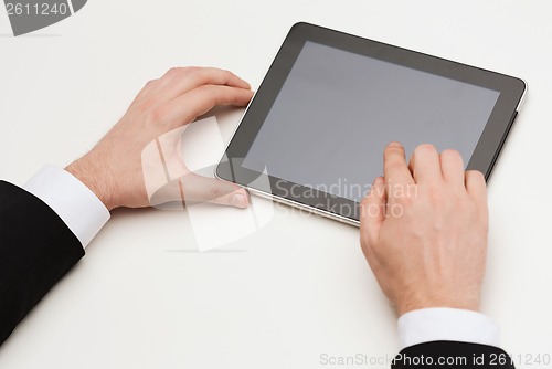 Image of close up of man hands touching tablet pc