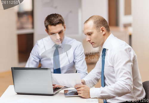 Image of two businessmen having discussion in office