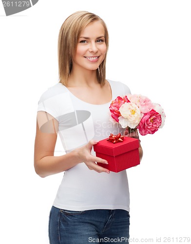 Image of smiling woman with bouquet of flowers and gift box