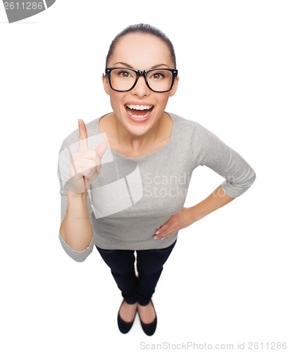 Image of asian woman in eyeglasses with finger up