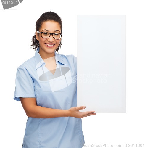 Image of female doctor or nurse with white blank board
