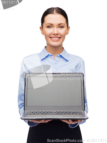 Image of smiling businesswoman with laptop blank screen