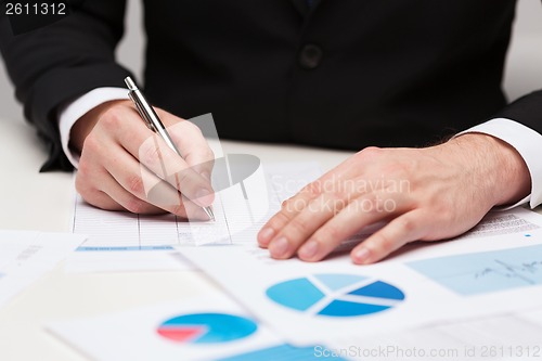 Image of close up of businessman with papers