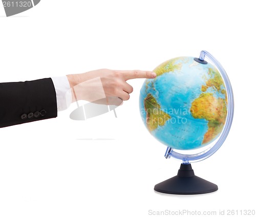 Image of businessman pointing finger to earth globe