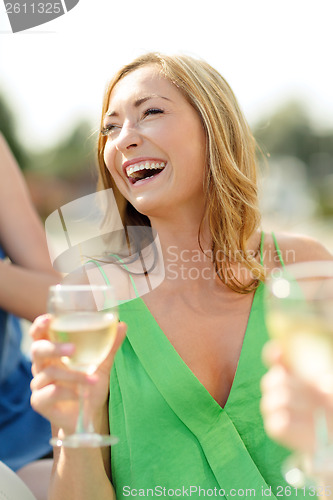 Image of laughing woman with wine glass