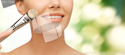 Image of beautiful woman with brush