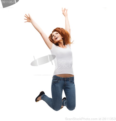 Image of teenage girl in white blank t-shirt jumping