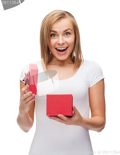 Image of smiling girl with gift box