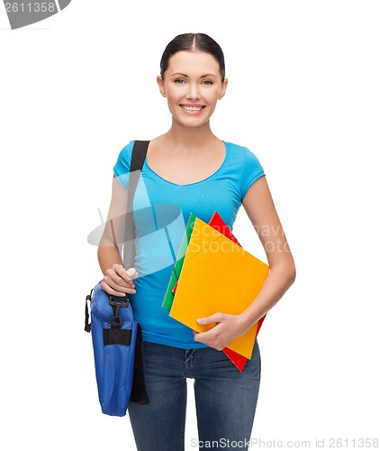 Image of smiling student with bag and folders