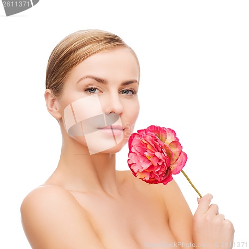 Image of lovely woman with peonie flower