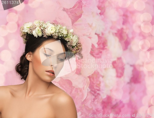 Image of beautiful woman wearing wreath of flowers