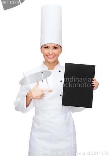 Image of smiling female chef with black blank paper