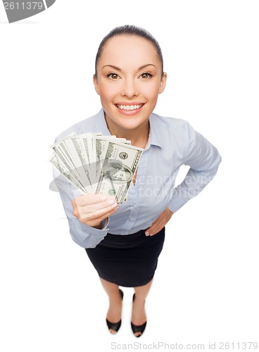 Image of smiling businesswoman with dollar cash money