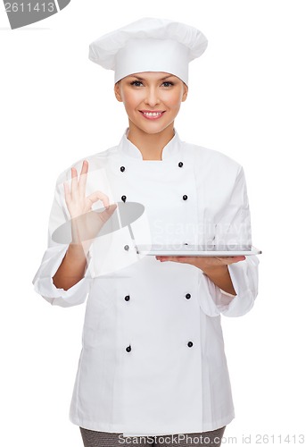 Image of smiling female chef with tablet pc computer