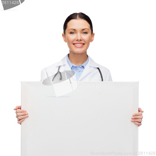 Image of female doctor with stethoscope and white board