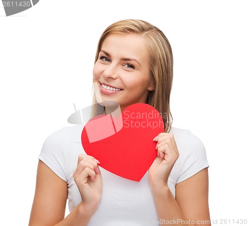 Image of smiling woman in white t-shirt with heart