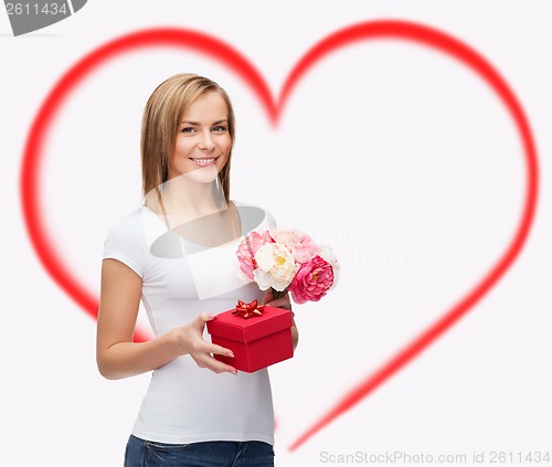 Image of smiling woman with bouquet of flowers and gift box