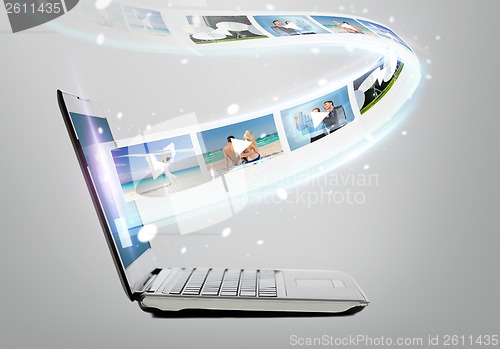 Image of laptop computer with video on screen