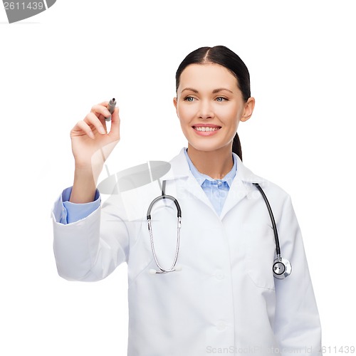 Image of female doctor working with something imaginary