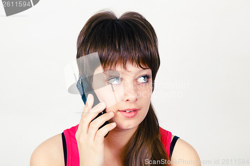 Image of Young girl talking on a cell phone