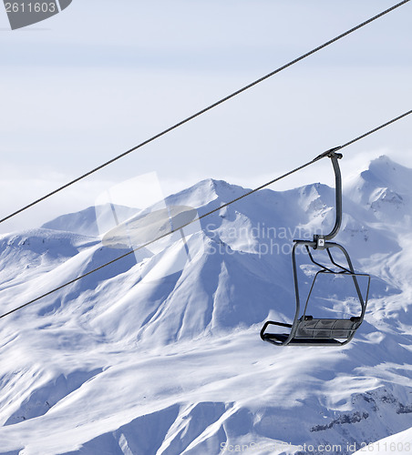Image of Chair lifts and off piste slope in fog