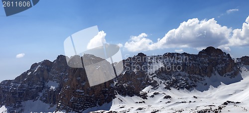 Image of Panorama of snowy mountains in spring