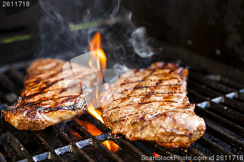 Image of Steaks on barbecue