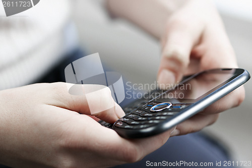 Image of Hands texting on phone