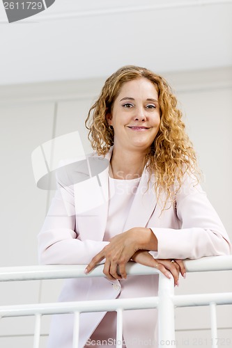 Image of Portrait of confident businesswoman in office