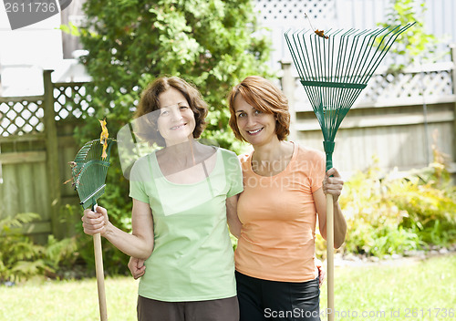 Image of Women with rakes in garden