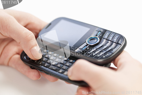 Image of Hands texting on phone