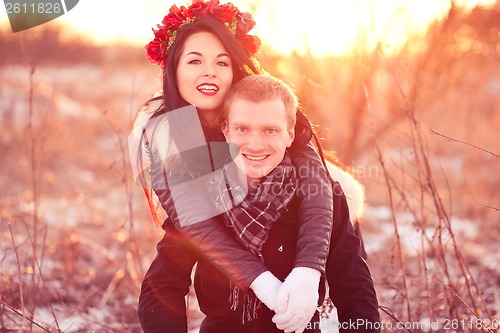 Image of Happy young couple smiling and hugging