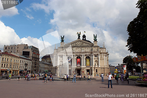 Image of people having a rest besides opera-house in Lvov