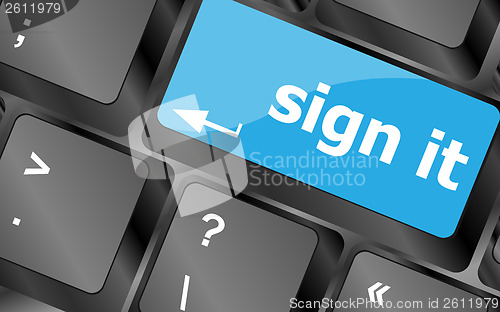 Image of sign it or login concept with key on computer keyboard