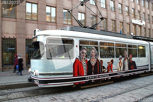 Image of Moving HSL Tram with Tommy Hilfiger Advertisement