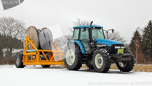 Image of New Holland 8160 Tractor with Power Cable on Trailer