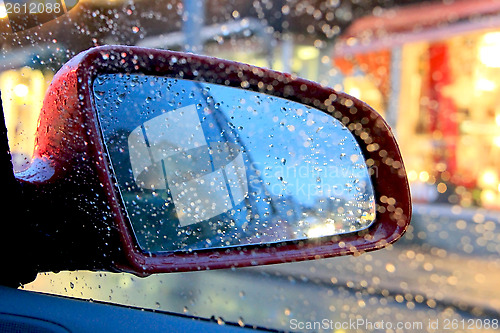 Image of Car Side View Mirror with Rain Drops