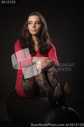 Image of Young woman in pink dress