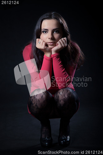 Image of Young woman in pink dress